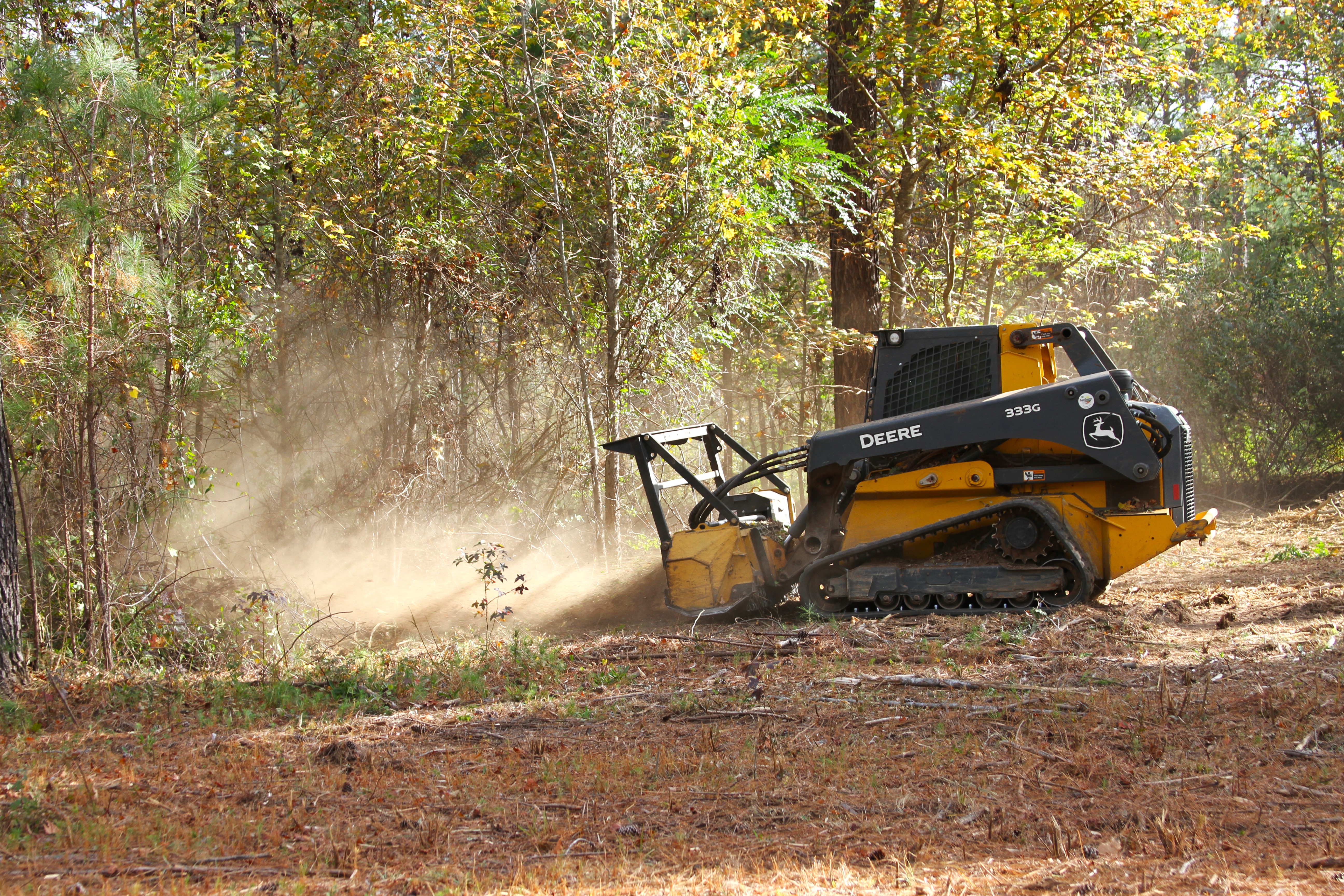 Forestry mulcher clearing underbrush on a Middle Georgia property